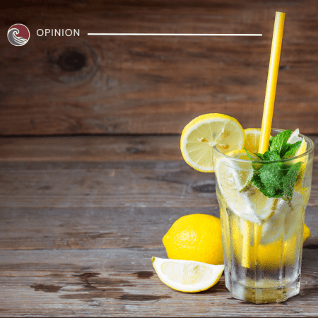 Glass of lemonade with lemon slices
